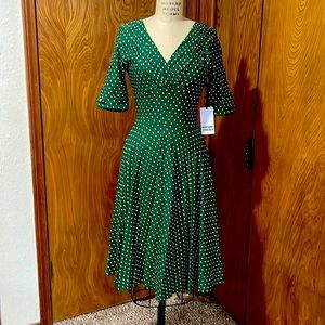 Unique Vintage 1950’s green and white pin dot Delores swing dress with sleeves.